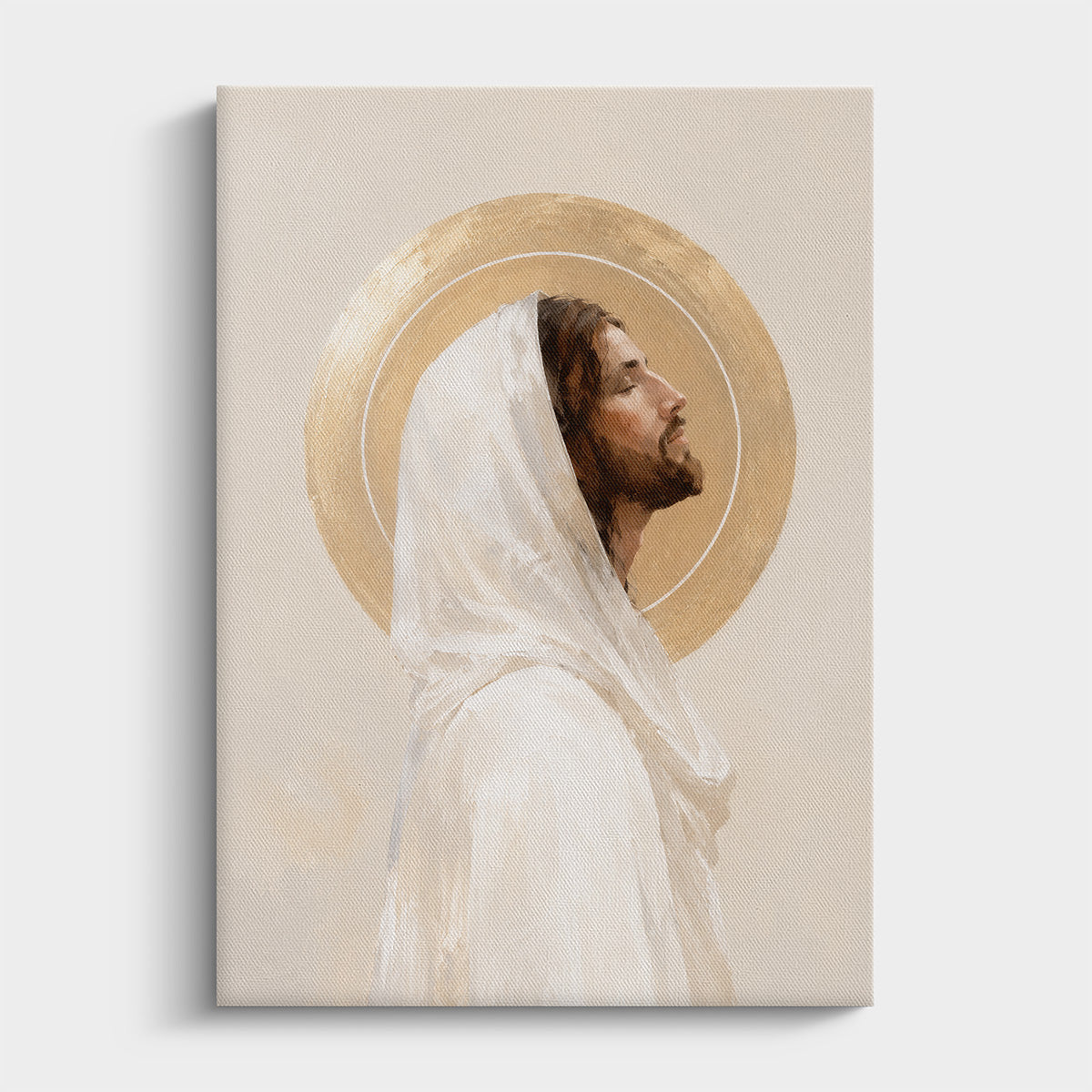 A vertical canvas print featuring a painted portrait of Jesus Christ with a gold halo and white robe, shown against a light gray background.
