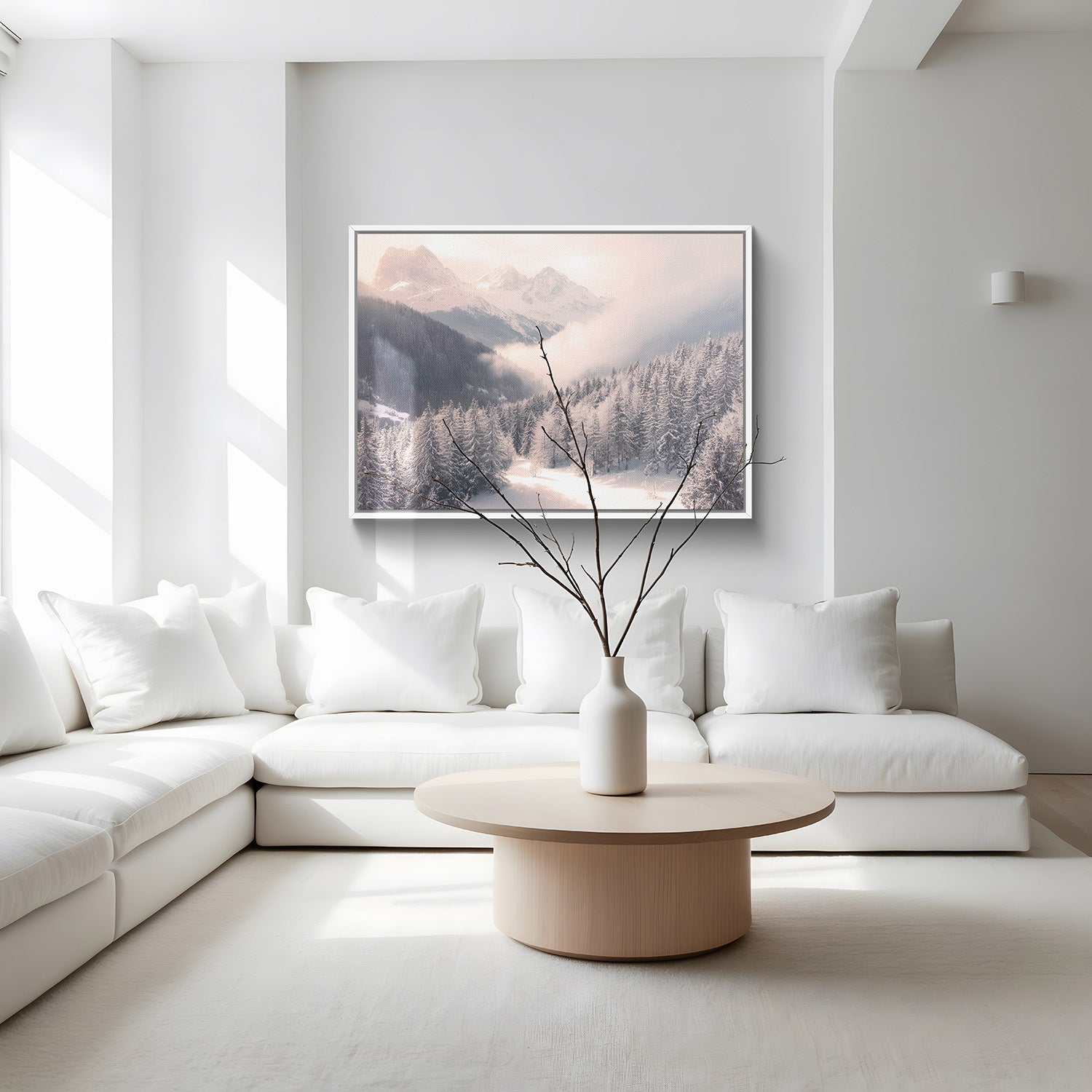 Modern living room with white sectional sofa, wooden coffee table, and framed landscape art.