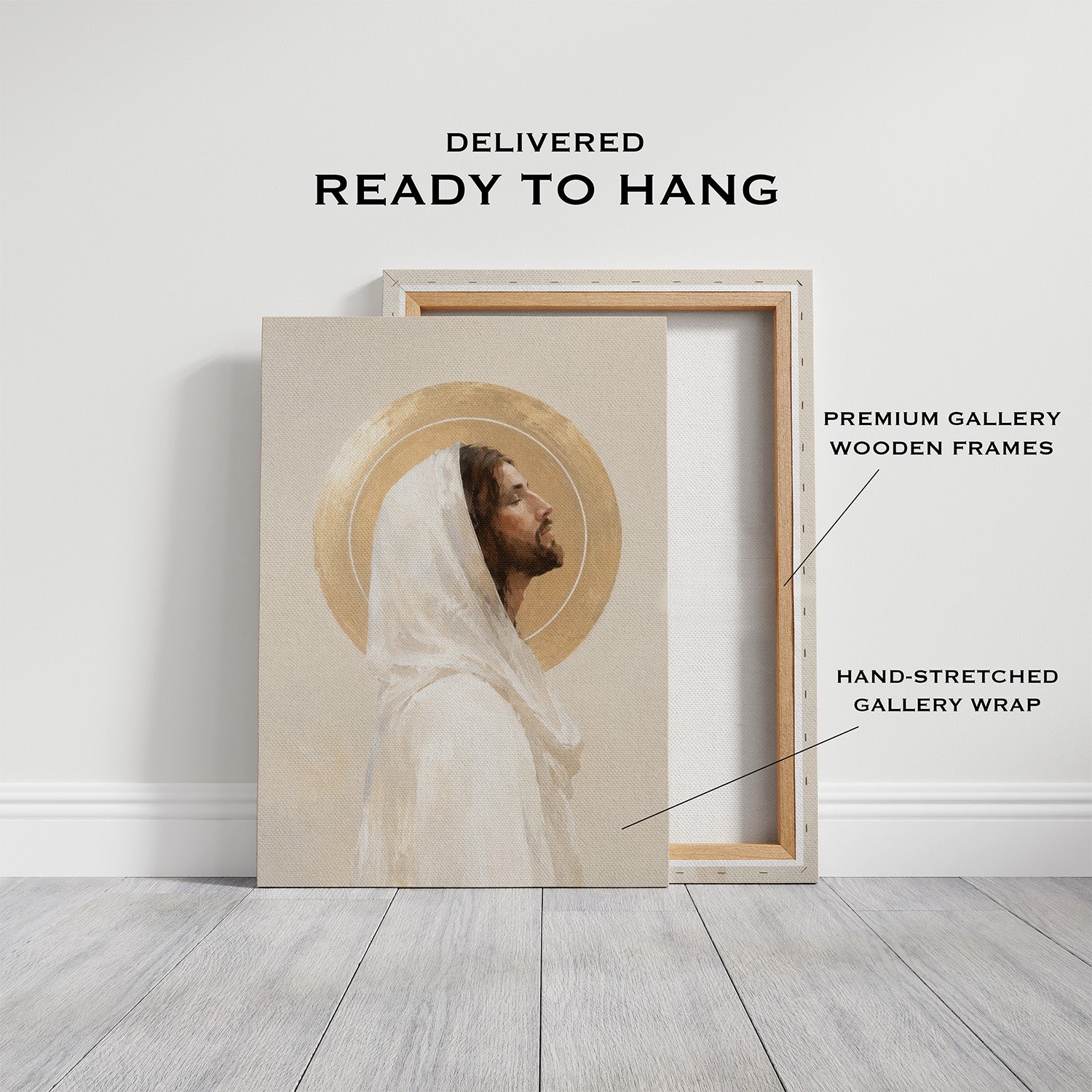 A framed wall art print leaning against a white wall on a light wood floor, with text reading 'DELIVERED READY TO HANG' and callouts for premium gallery wooden frames and hand-stretched gallery wrap.